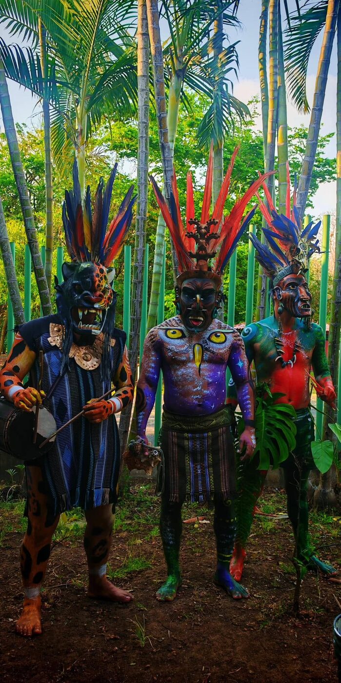 Boruca dancers in body paint and feathered masks