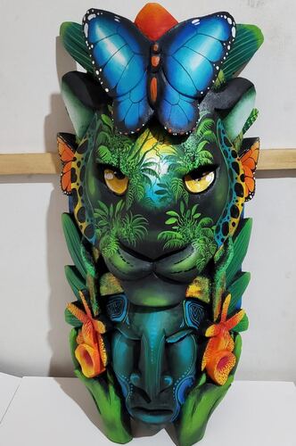 Boruca mask carved with a butterfly motif
