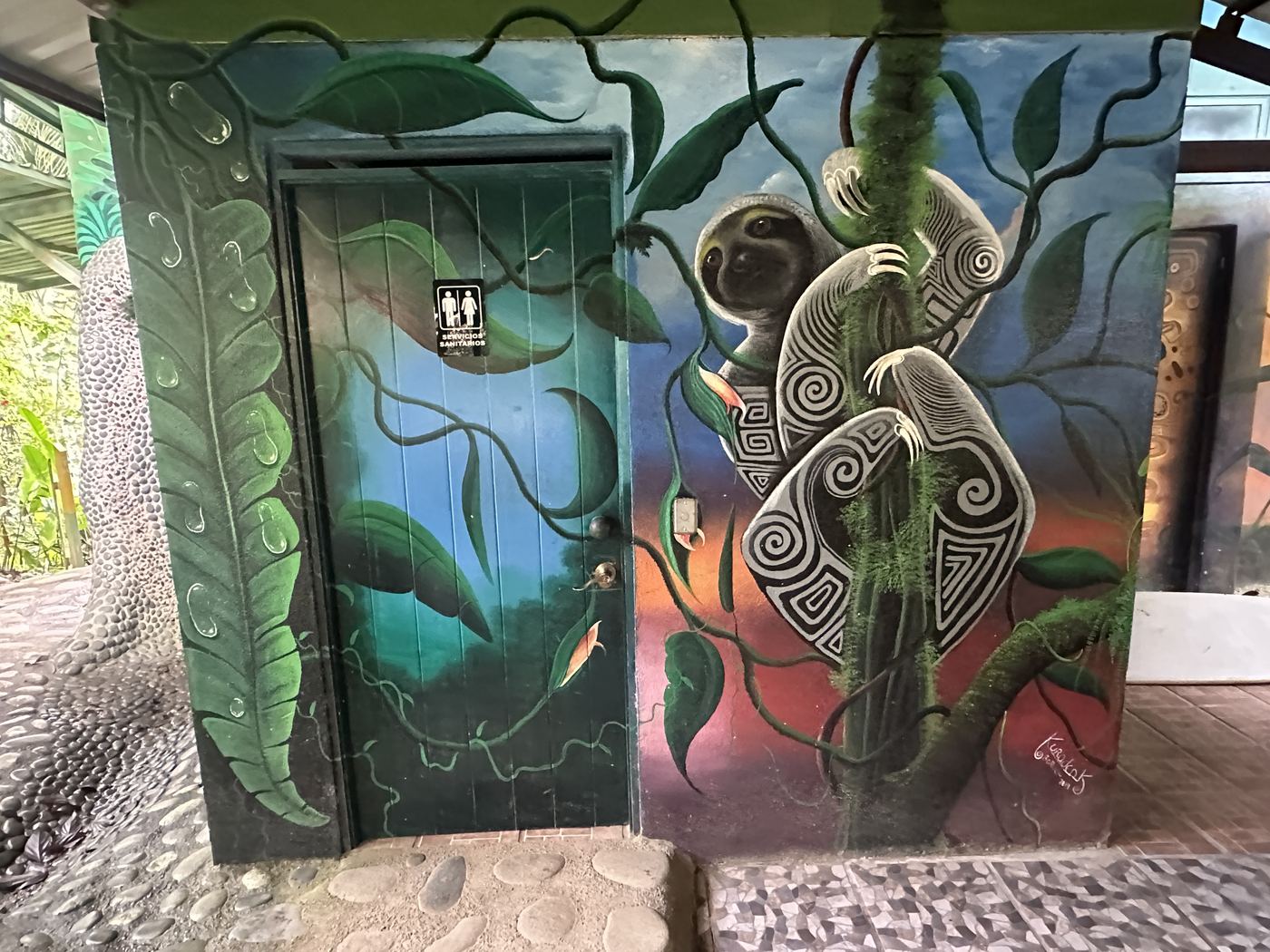 Sloth on the vine mural at La Cusinga Lodge, Uvita