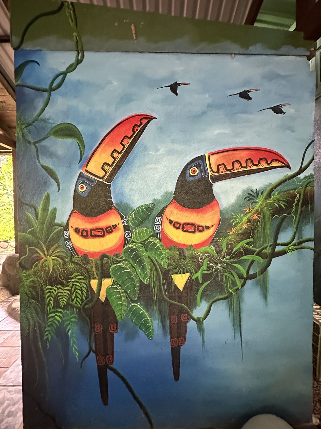 Toucans in ceremonial dress mural at La Cusinga Lodge, Uvita